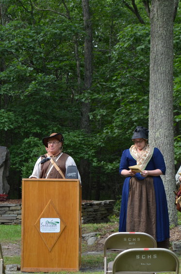Members of the Navasing Longrifles read off the names of the fallen from the Battle of Minisink.